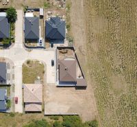 Aerial view of family houses in Suchá nad Parnou in Vlčia Dolina, plots - housing.