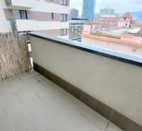 The balcony of a 2-room apartment with a view of the surrounding buildings in Bratislava - Ružinov, Jégého.