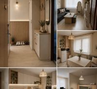 Cozy interior of a 2-room apartment with a wooden decor floor and subtle decorations.