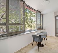 Balcony with a view, table with chairs, large windows, 4-room apartment.