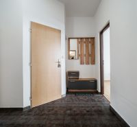 Entrance hallway in a 2-room apartment with practical furniture and ceramic flooring.