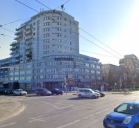 The building on Tomášikova Street in Bratislava - Ružinov, busy intersection and traffic.