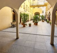 Arcade with arches and flower pots on Hviezdoslav Square in Bratislava - Old Town.
