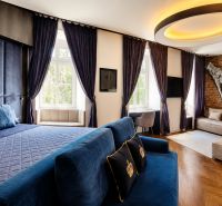 2-room apartment with a luxurious design, blue accents, and flooring with a wood decor.