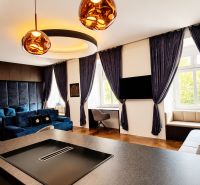 Interior of a 2-room apartment with built-in lighting, curtains, and flooring with a wooden decor.