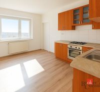 A kitchen with wooden decor and appliances in a 2-room apartment.