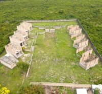 Vacant buildings and green spaces in the commercial area of Matemwe, Unguja North East.