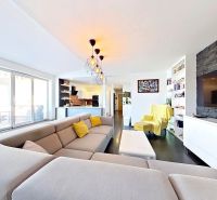 Living room with a large sofa and a television in a 3-room apartment.