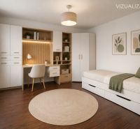 A room in a 3-room apartment with a built-in desk, storage spaces, and a floor with a wood decor.