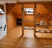 Attic room with wooden decor and shelves in a family house.