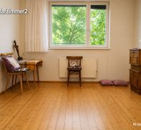 A room in a family house with a wooden decor floor and furniture.