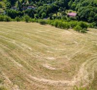 A spacious green residential plot on Obrancov Mieru Street, Banská Štiavnica, surrounded by nature.
