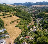 Aerial view of the landscape and houses around Banská Štiavnica, Obrancov Mieru Street.