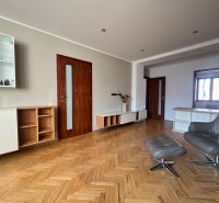 Living room with a sofa set and wood-patterned flooring in a 4-room apartment.