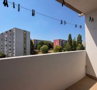 The balcony of a 2-room apartment on Škultétyho Street in Nitra with a view of the panel buildings.