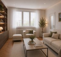 Living room in a two-room apartment with wood-patterned flooring, beige furniture, and greenery.