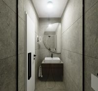 Bathroom in a 3-room apartment with a sink, mirror, and gray walls.