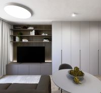 Living room with TV and built-in wardrobes in a 3-room apartment.