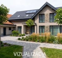 A family house in Dobrá Niva with a landscaped garden and stone cladding on the facade.