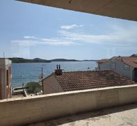 View from a 3-bedroom apartment in Srima of the sea and the beach under the yellow house.