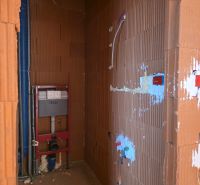 Bathroom installation in a 3-room apartment, prepared space for the toilet.
