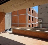An unfinished 3-room apartment in the town of Srima with a view of brick walls.