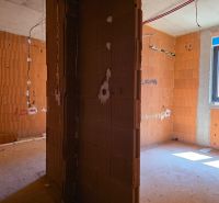 Interior of a 3-room apartment with brick partitions, in the rough construction stage.