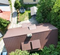 Aerial view of the Cottage in Špania Dolina in Banská Bystrica with a trampoline in the yard.