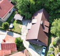 Aerial view of a cottage in Špania Dolina, Banská Bystrica, surrounded by greenery.