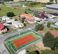 Tennis court and family houses on Nová Polhora Street in Nová Polhora.