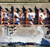 Construction of a family house in Nová Polhora on Nová Polhora Street from an aerial view.