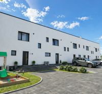 A family house in Nová Polhora on Nová Polhora Street with a parking lot and a children's playground.