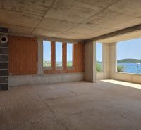 Unfinished 4-room apartment in SRIMA with a sea view through open windows.