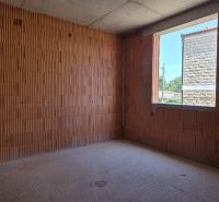 Interior construction in a 4-room apartment with brick walls and a concrete floor.
