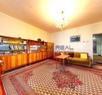Living room in a family house with a wooden decor floor and antique furniture.