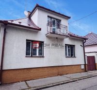 A family house on Sadová Street in Piešťany with a white facade and a sloped roof.