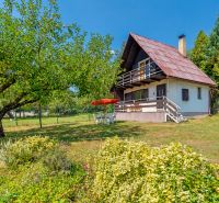 A cottage in Lazy pod Makytou on Dubková with fruit trees and a garden.