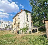 A family house on Levická Street in Vráble, surrounded by greenery and lawn.