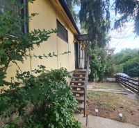 A family house in Svodín, with a front garden and a staircase to the main entrance.