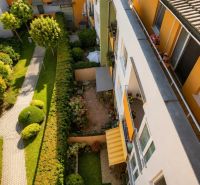 The view from the apartment building on Čerešňová Street in Chorvátsky Grob with a landscaped garden.