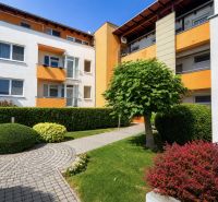 Apartment building on Čerešňová Street in Chorvátsky Grob surrounded by landscaped greenery.