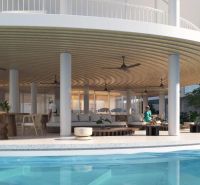 Poolside seating with a bar under construction in an apartment complex in Surat Thani.