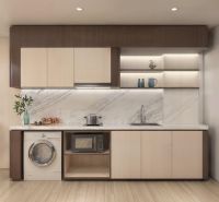 A kitchen with a marble backsplash in a 2-room apartment, flooring with a wooden decor.