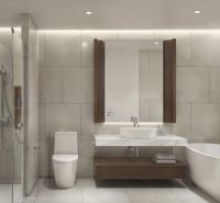A bathroom in a 2-room apartment with a bathtub, shower, and modern sink.
