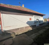 A family house in Tvrdošovce with a protruding veranda and a sloped roof.