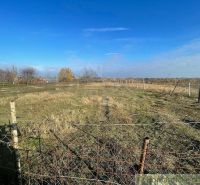 A vast plot of land fenced with a wire fence around Tvrdošovce.
