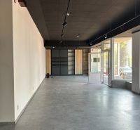 Spacious offices with large windows and decorative flooring.