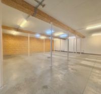 Open-plan commercial spaces with visible beams.