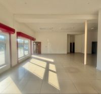 Bright commercial spaces with large windows and tiled flooring.