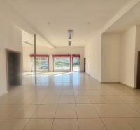 Bright commercial spaces with tiles and large windows provide plenty of natural light.